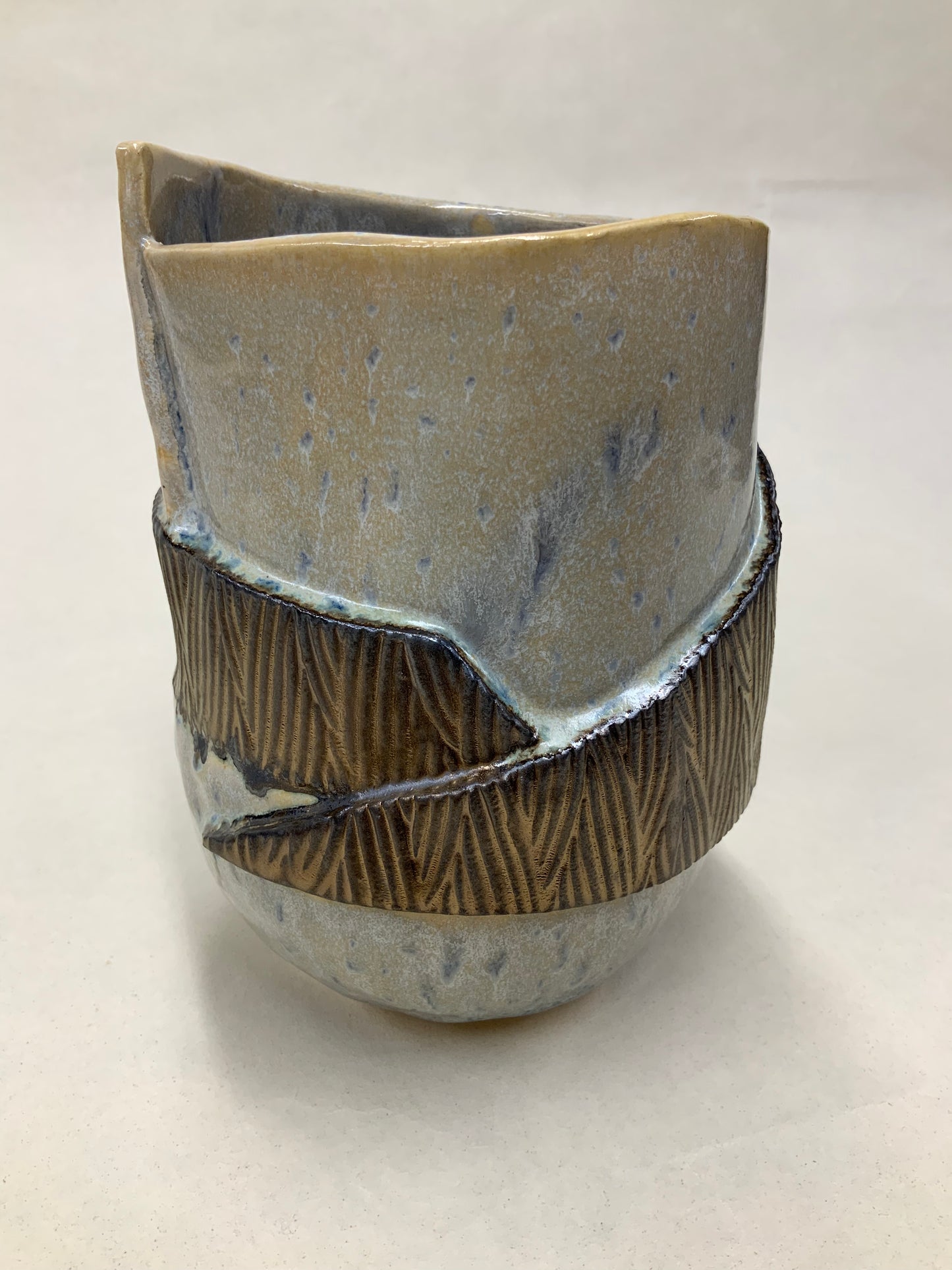 grey cream and gold bucket vessel