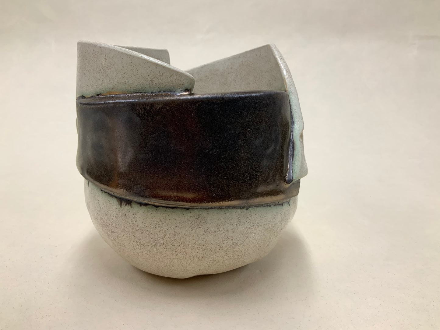 speckled cream and gold banded vessel