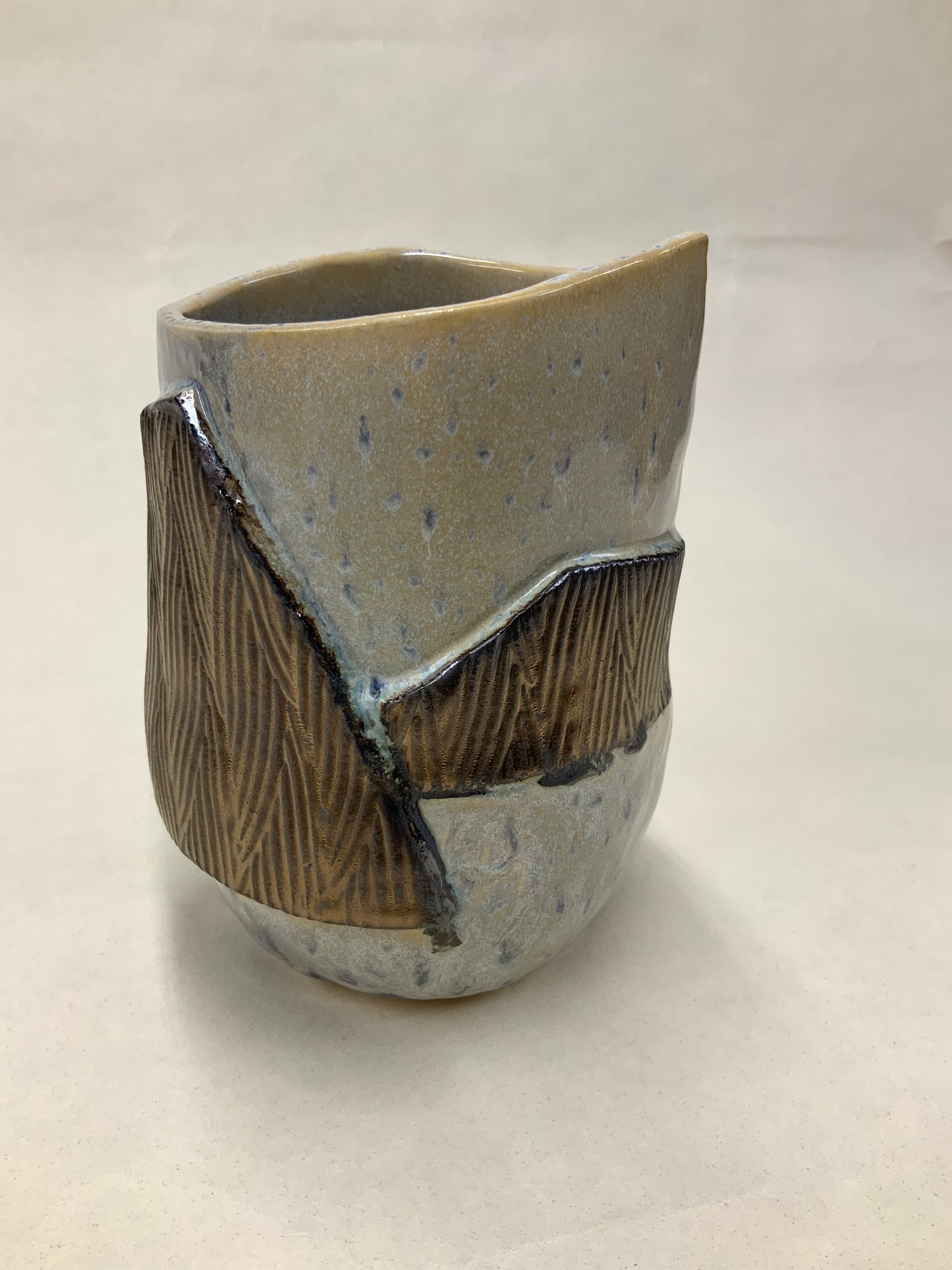 grey cream and gold bucket vessel