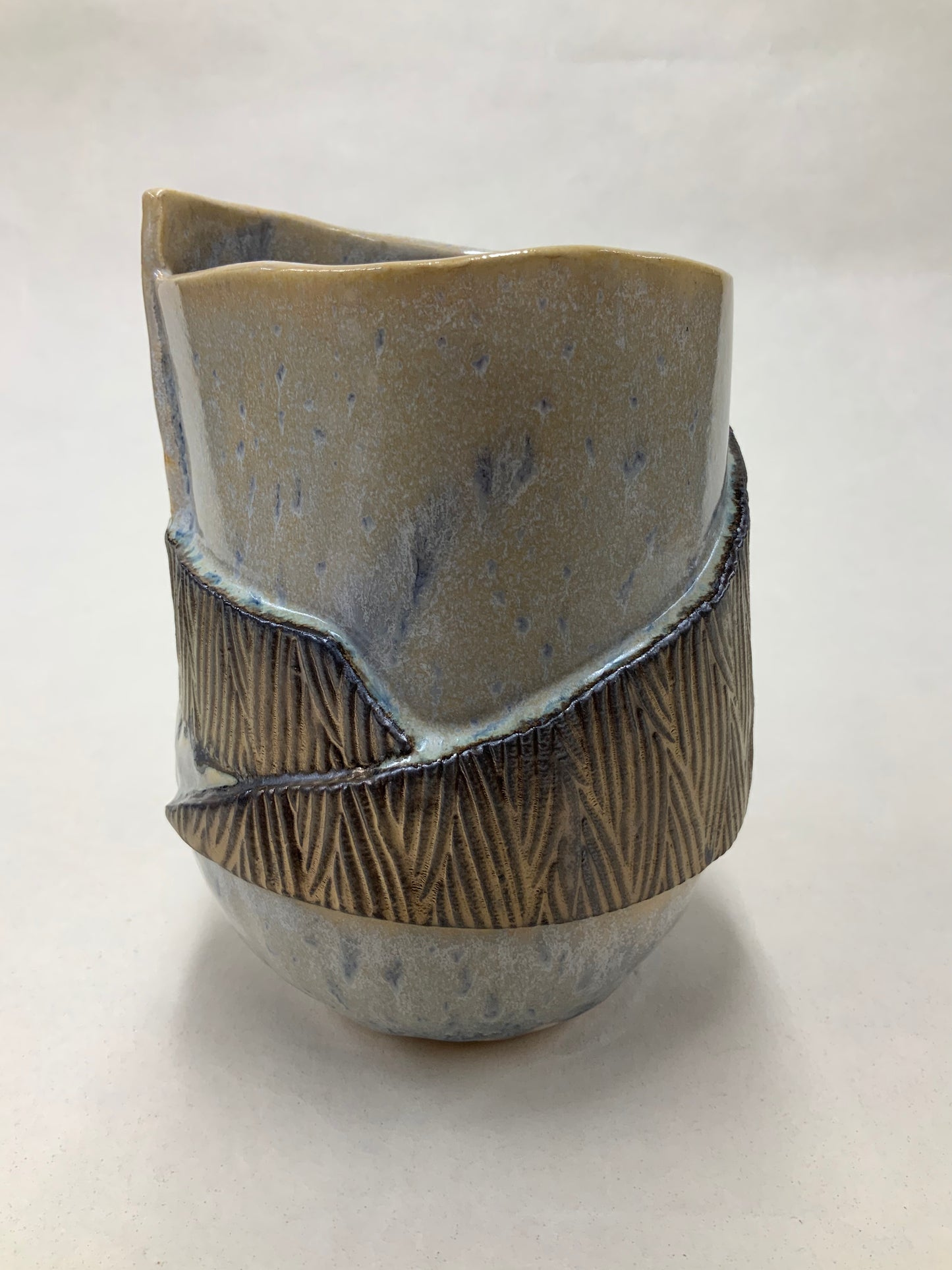 grey cream and gold bucket vessel