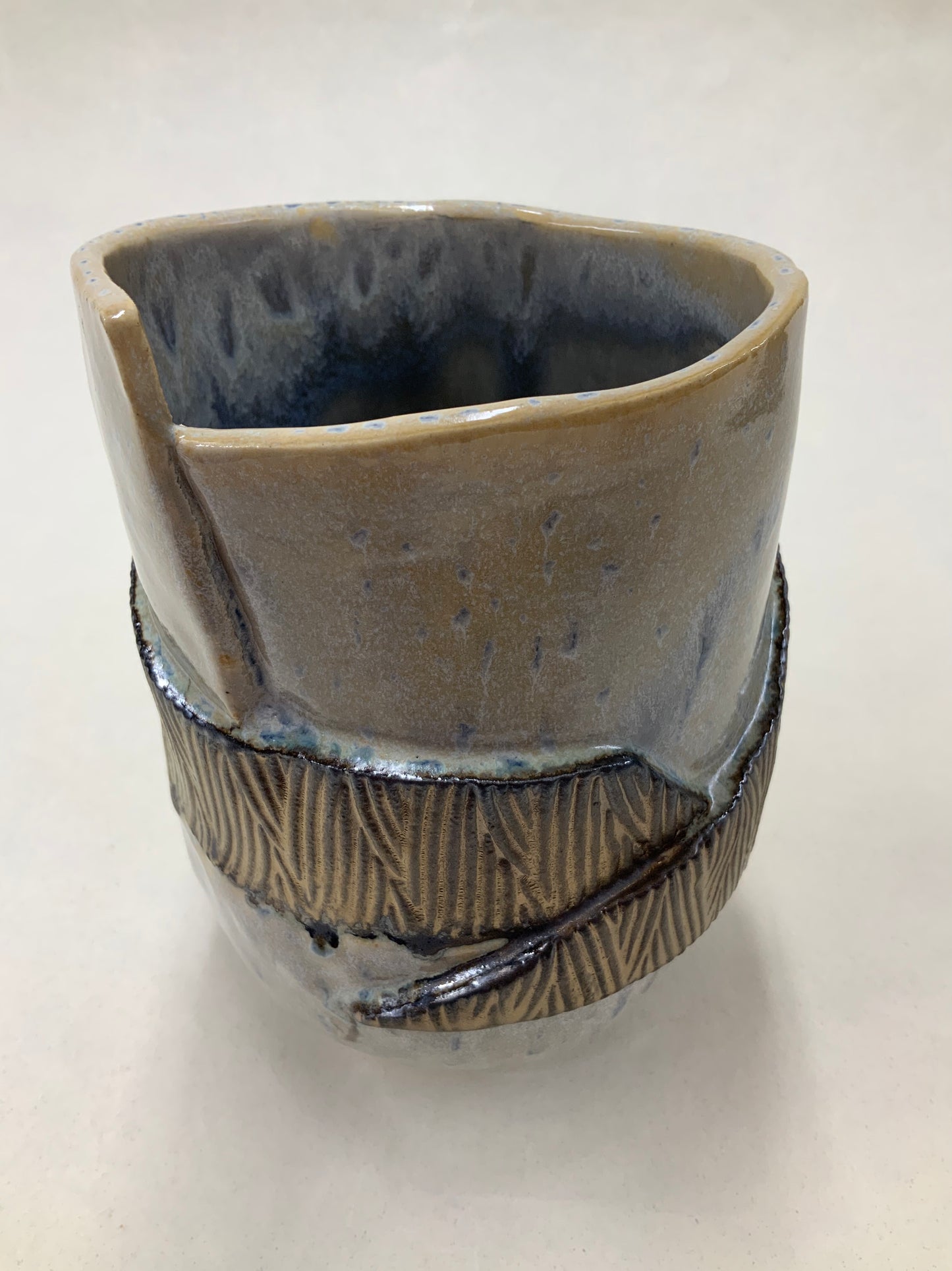 grey cream and gold bucket vessel