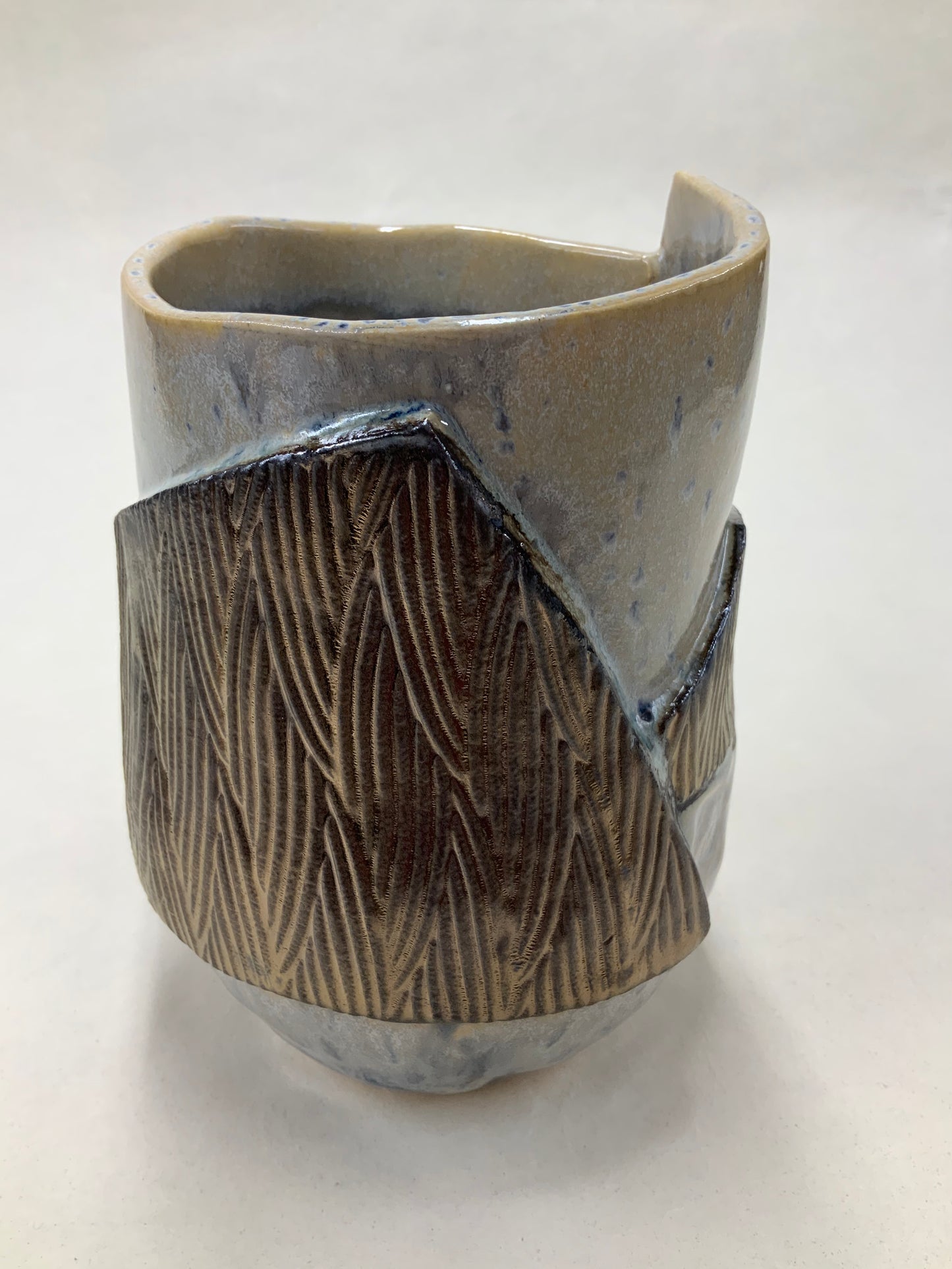 grey cream and gold bucket vessel
