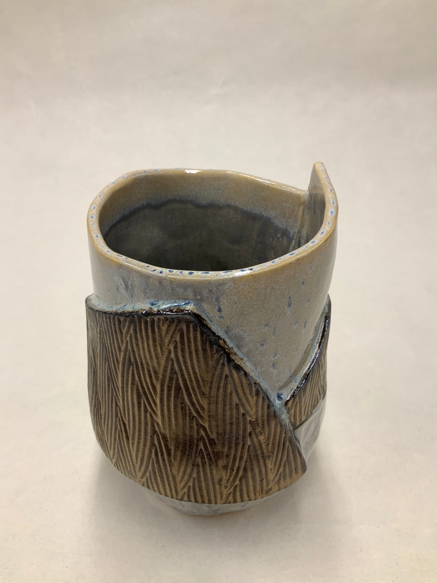 grey cream and gold bucket vessel