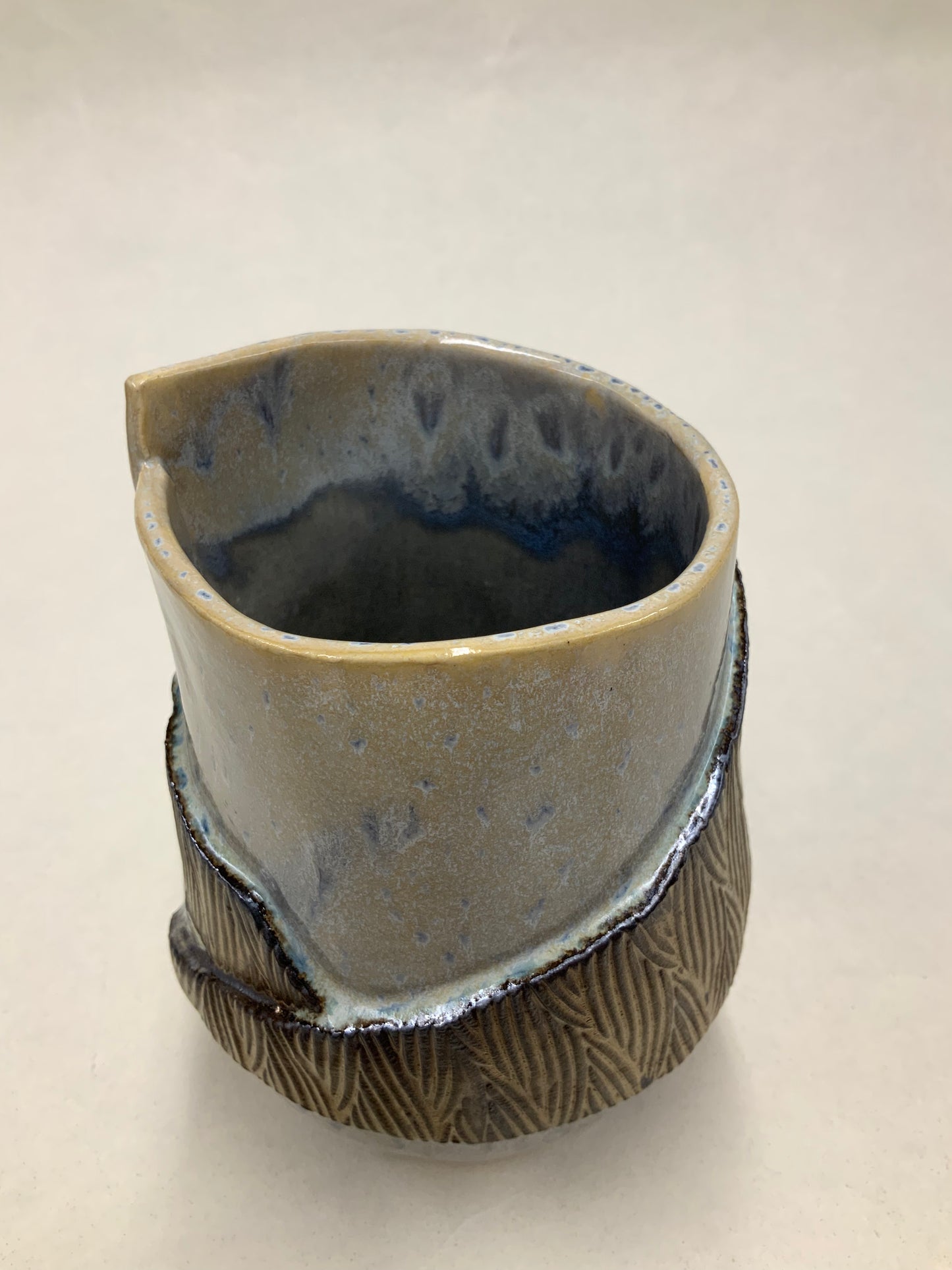 grey cream and gold bucket vessel
