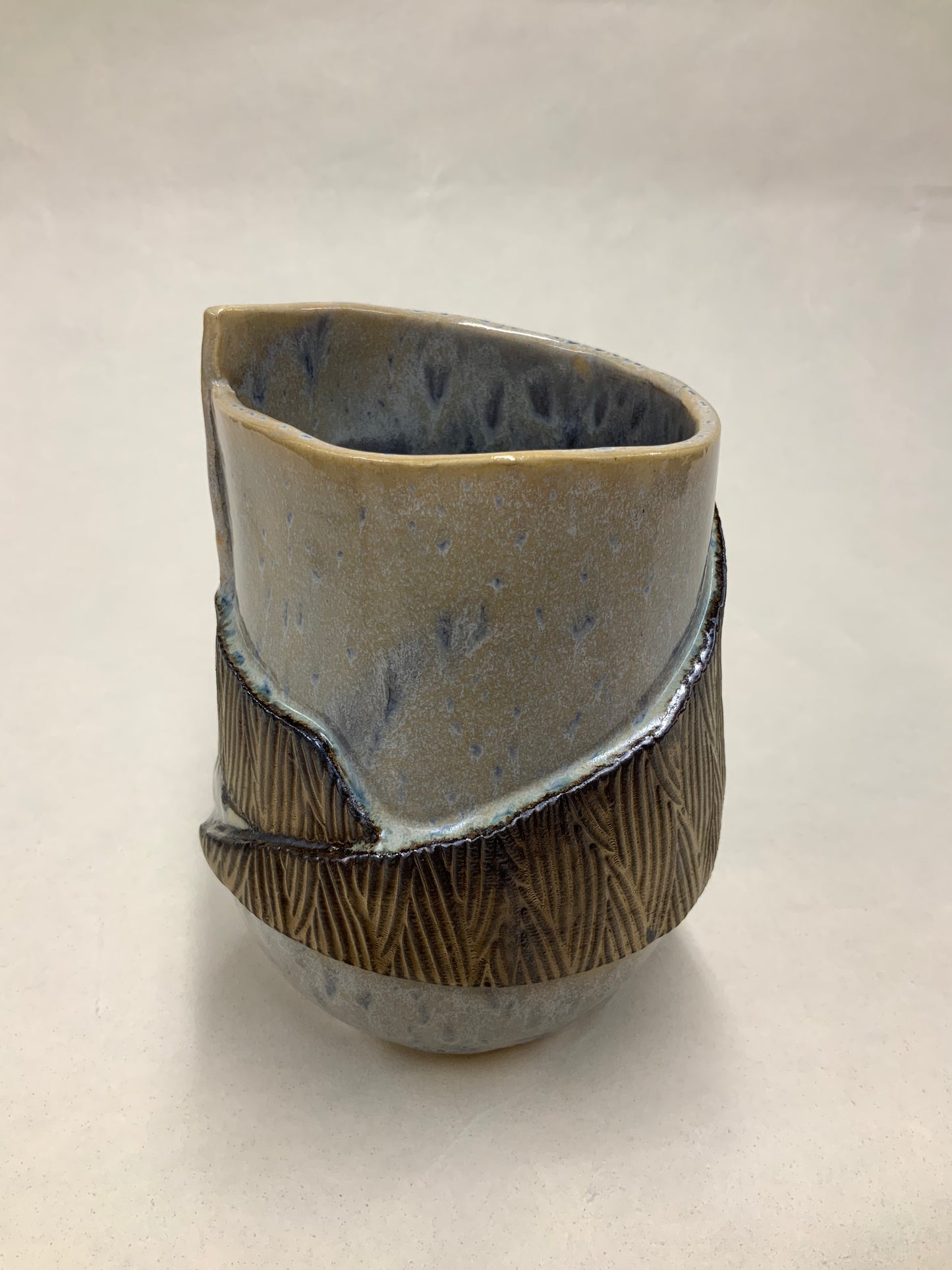 grey cream and gold bucket vessel