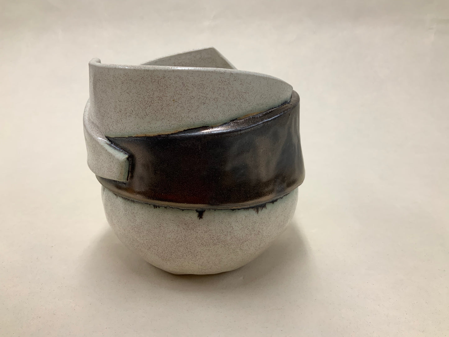 speckled cream and gold banded vessel