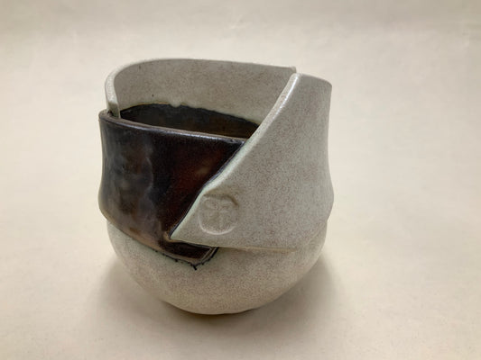 speckled cream and gold banded vessel