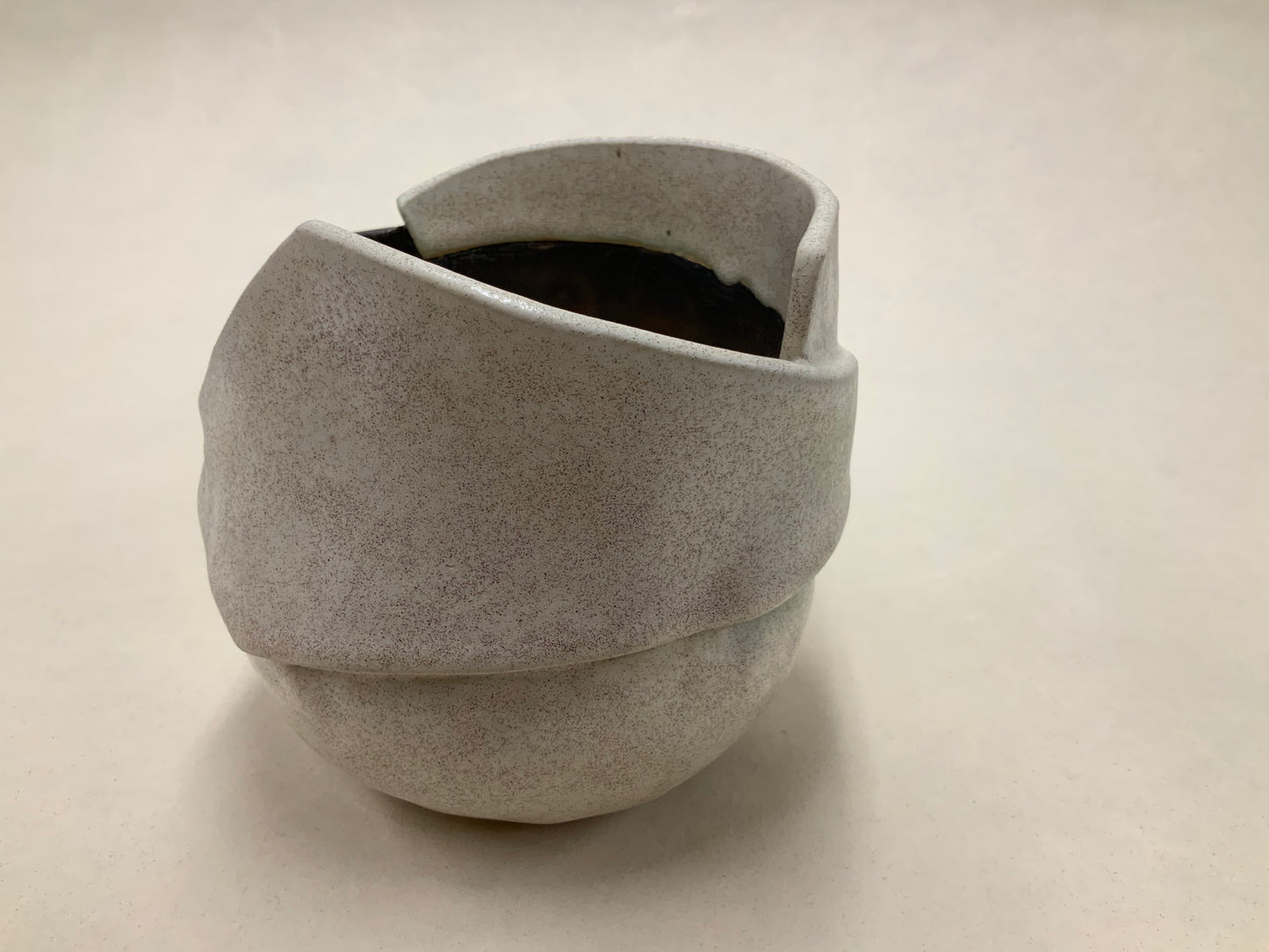 speckled cream and gold banded vessel