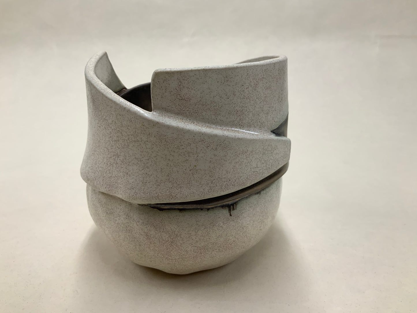 speckled cream and gold banded vessel