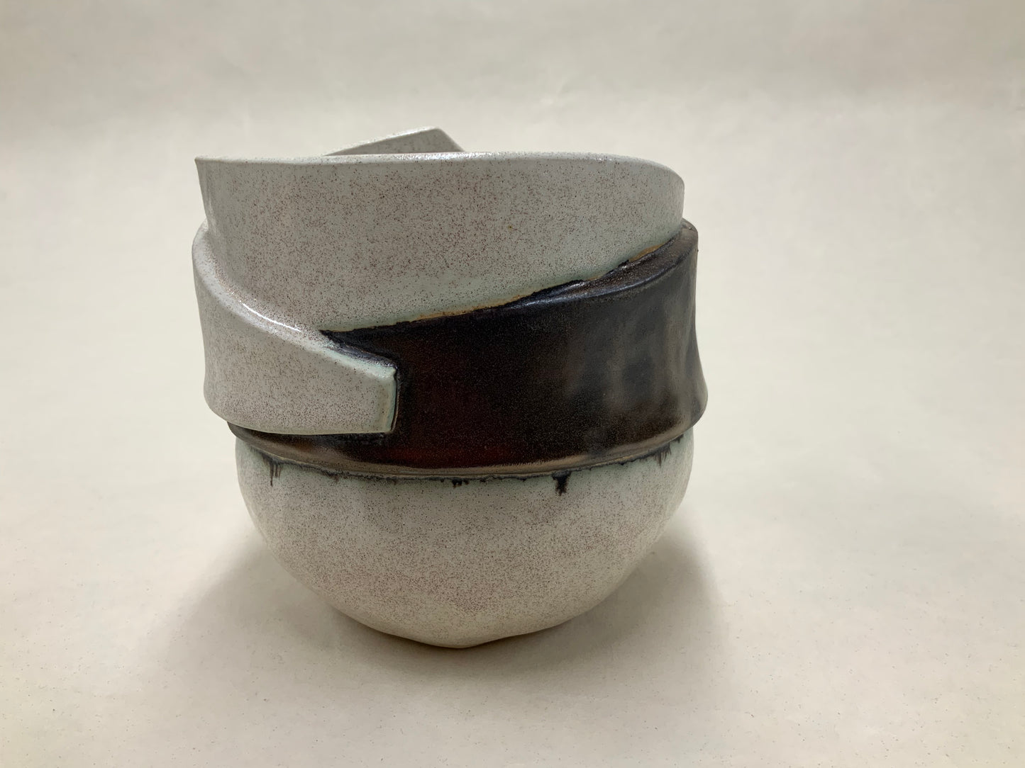 speckled cream and gold banded vessel