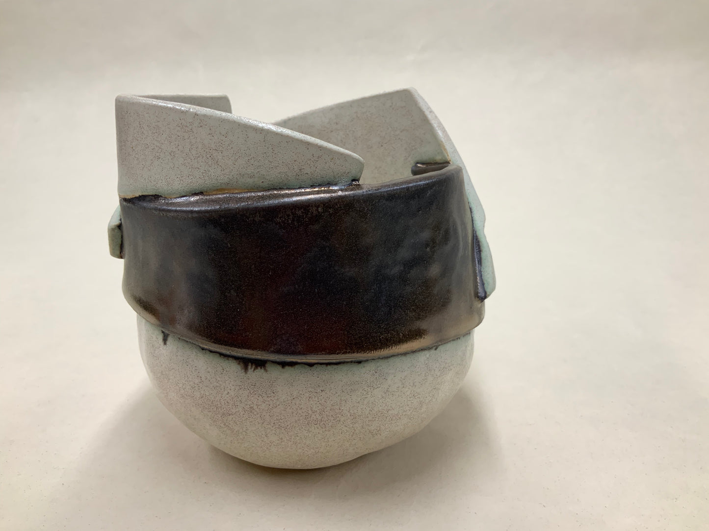 speckled cream and gold banded vessel