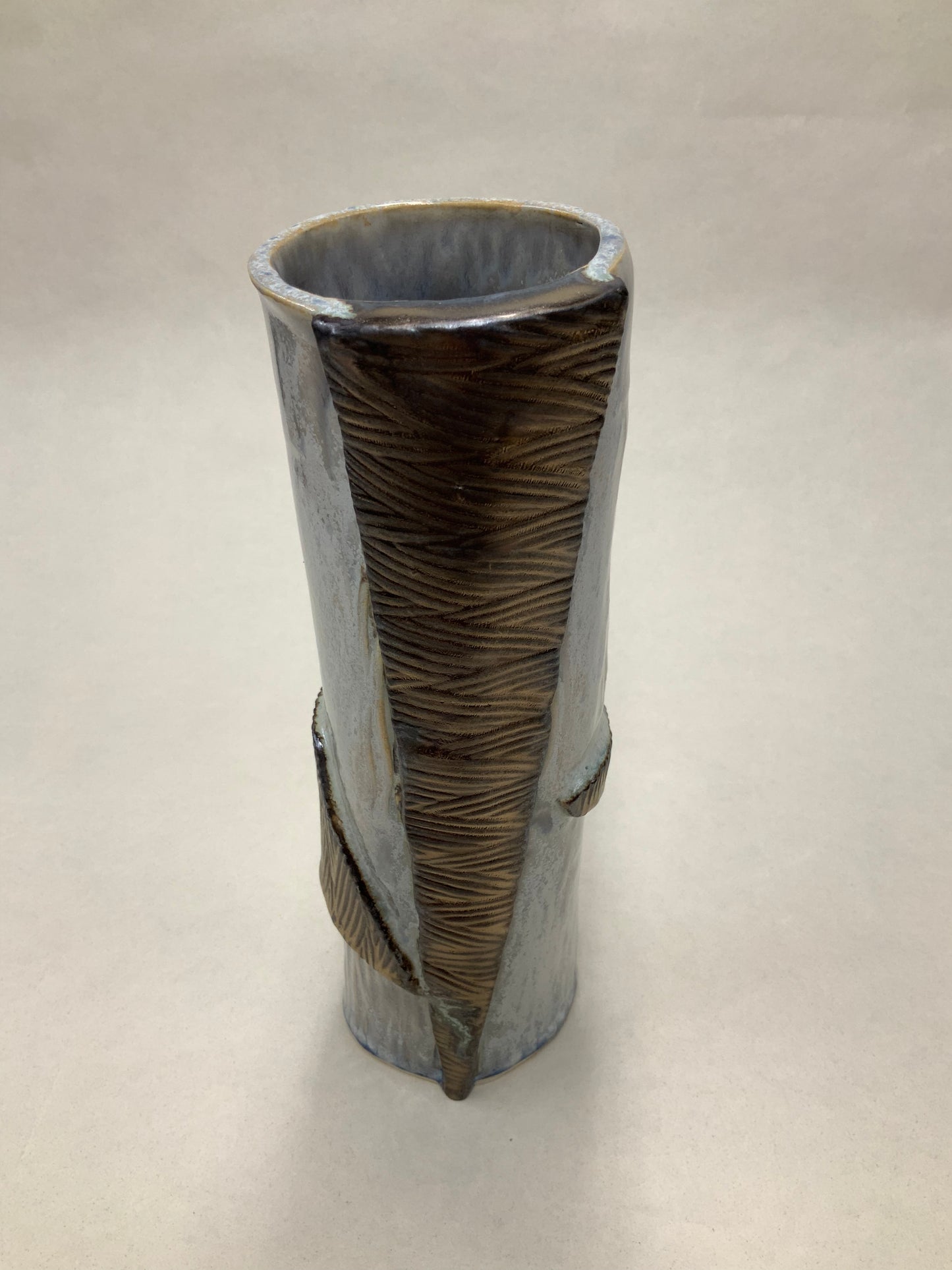 grey cream and gold vessel